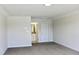 Spacious bedroom with neutral carpeting, trim, and an ensuite bathroom, designed for relaxation at 79 Surles Landing Way, Benson, NC 27504