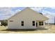 Rear view of a home showcasing the home's siding, windows, and covered back porch at 79 Surles Landing Way, Benson, NC 27504