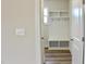 Mudroom with a built-in bench, shelves and hooks at 79 Surles Landing Way, Benson, NC 27504