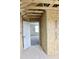 View of new construction featuring exposed wood framing and an open doorway at 79 Surles Landing Way, Benson, NC 27504