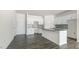 Modern kitchen with granite countertops and white cabinets at 850 Old Tarboro Rd, Wendell, NC 27591