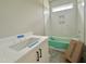 Modern bathroom with herringbone-patterned tile, a sleek vanity, and great lighting at 130 Broadleaf Ln, Louisburg, NC 27549