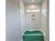 New bathroom with vertical tiles and a green soaking tub ready for relaxation at 130 Broadleaf Ln, Louisburg, NC 27549