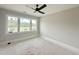 Light-filled bedroom featuring large windows that offer serene views at 130 Broadleaf Ln, Louisburg, NC 27549