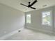 Bedroom with two windows and ceiling fan at 130 Broadleaf Ln, Louisburg, NC 27549