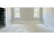 Empty bedroom with two windows providing natural light and closet at 130 Broadleaf Ln, Louisburg, NC 27549