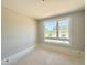 Bright bedroom featuring large windows that provide ample natural light at 130 Broadleaf Ln, Louisburg, NC 27549