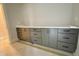 A counter with modern gray cabinets, sleek handles, and a clean white countertop at 130 Broadleaf Ln, Louisburg, NC 27549