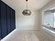 Bright dining room featuring a stylish woven chandelier and a large window with natural light at 130 Broadleaf Ln, Louisburg, NC 27549