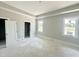 Bright main bedroom featuring windows for natural light and large closet at 130 Broadleaf Ln, Louisburg, NC 27549