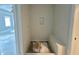 Bright white tiled shower features a built-in bench and a sleek, modern design at 130 Broadleaf Ln, Louisburg, NC 27549