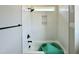 Bright bathroom featuring a shower-tub combo with white tiling and sleek black hardware at 130 Broadleaf Ln, Youngsville, NC 27596