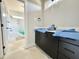 Bathroom featuring modern dark-stained cabinets with a white countertop under construction at 130 Broadleaf Ln, Youngsville, NC 27596