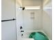 Modern bathroom shower features white tile, black fixtures, and a built-in niche at 130 Broadleaf Ln, Youngsville, NC 27596