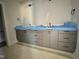 Bathroom with double vanity with black hardware and light fixtures at 130 Broadleaf Ln, Youngsville, NC 27596