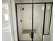 Modern bathroom featuring a glass-enclosed shower with black hardware and white tiling at 130 Broadleaf Ln, Youngsville, NC 27596