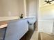 Bathroom featuring modern dark-stained cabinets with a white countertop with a view to a finished bedroom at 130 Broadleaf Ln, Youngsville, NC 27596