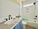 Modern bathroom features white tile, black fixtures, and a built-in shower niche at 130 Broadleaf Ln, Youngsville, NC 27596