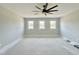 Spacious bedroom with three large windows offering abundant natural light at 130 Broadleaf Ln, Youngsville, NC 27596