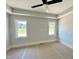 Bedroom with trey ceilings, windows, and a ceiling fan at 130 Broadleaf Ln, Youngsville, NC 27596