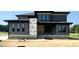 Modern two-story home with gray siding and black trim at 130 Broadleaf Ln, Youngsville, NC 27596