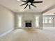 Bright living room featuring a fireplace and double doors at 130 Broadleaf Ln, Youngsville, NC 27596