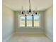 Living room with a window overlooking a large lawn at 130 Broadleaf Ln, Youngsville, NC 27596