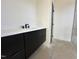 Modern bathroom featuring a sleek black vanity and contemporary design at 135 Cherry Bark Dr, Youngsville, NC 27596