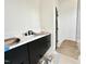 Modern bathroom featuring sleek black cabinets and a white countertop, ready for finishing touches at 135 Cherry Bark Dr, Youngsville, NC 27596