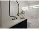 Bathroom featuring a modern vanity with a sleek black faucet and a glass-enclosed shower at 135 Cherry Bark Dr, Youngsville, NC 27596