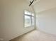 An unfinished bedroom boasting a ceiling fan and a large window offering serene outdoor views at 135 Cherry Bark Dr, Youngsville, NC 27596