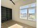 Bright bedroom with built-in shelving and a window view of the outdoors at 135 Cherry Bark Dr, Youngsville, NC 27596