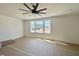 Bedroom featuring bright light from a large window, and a modern ceiling fan at 135 Cherry Bark Dr, Youngsville, NC 27596