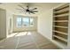 Bright bedroom with natural light, built in shelves and large window with outdoor views at 135 Cherry Bark Dr, Youngsville, NC 27596