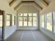 Sun-filled dining room featuring vaulted ceilings, exposed beams, a modern chandelier, and large windows at 135 Cherry Bark Dr, Youngsville, NC 27596