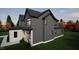 New construction features modern design, including gray siding and contrasting black trim at 135 Cherry Bark Dr, Youngsville, NC 27596