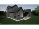 Modern home features large windows and gray siding, offering lots of natural light at 135 Cherry Bark Dr, Youngsville, NC 27596
