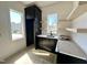 Well-appointed kitchenette with modern cabinets, shelves, and sink at 135 Cherry Bark Dr, Youngsville, NC 27596
