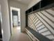 Custom mudroom design with built-in bench, shelves, and drawers at 135 Cherry Bark Dr, Youngsville, NC 27596
