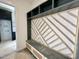 Custom mudroom with built-in bench, stylish wood design, and storage cubbies offers organization at 135 Cherry Bark Dr, Youngsville, NC 27596