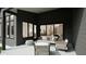 Covered patio area featuring comfortable seating and modern design elements at 135 Cherry Bark Dr, Youngsville, NC 27596
