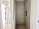 A modern shower with sleek gray tiles and recessed storage, perfect for a luxurious bathing experience at 135 Cherry Bark Dr, Youngsville, NC 27596
