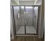 Bathroom featuring enclosed shower with sleek glass doors and modern fixtures at 163 Vili Dr, Broadway, NC 27505