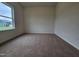 Well-lit bedroom features plush carpeting, neutral walls, and ample natural light at 163 Vili Dr, Broadway, NC 27505