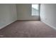 Comfortable bedroom with neutral walls, plush carpeting, and bright window view at 163 Vili Dr, Broadway, NC 27505