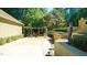 Serene backyard featuring a pergola, water feature, and lush greenery, creating a tranquil retreat with privacy and charm at 2213 Weybridge Dr, Raleigh, NC 27615