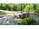 Outdoor dining area features custom pavers and lush landscaping at 2213 Weybridge Dr, Raleigh, NC 27615