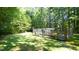 Spacious backyard featuring a large enclosed garden area for growing plants or raising chickens at 2213 Weybridge Dr, Raleigh, NC 27615
