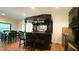 Custom bar featuring dark wood, glass racks, wine storage, and ample counter space at 2213 Weybridge Dr, Raleigh, NC 27615