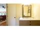 Bathroom featuring a vanity with marble countertop and a rustic mirror at 2213 Weybridge Dr, Raleigh, NC 27615